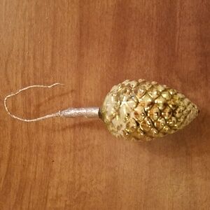 Vintage gold colored pinecone ornament.
